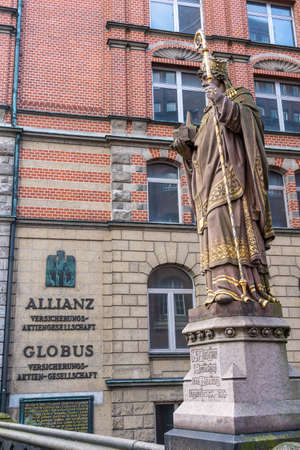 The historic bishop Ansgar statueon Trostbrucke bridge in Hamburg, Germanyの写真素材