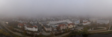 Schwerin, Germany - November 11, 2019: Aerial Panoramic view of houses by lake schwerin with fog...