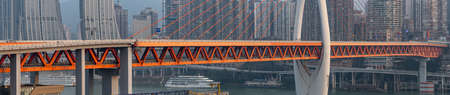 Chongqing, China - Dec 22, 2019: Panorama view of Qian si men suspension bridge deck over Jialing riverの写真素材