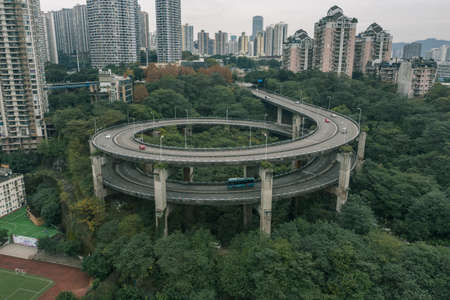 Aerial drone shot of particular double circle flyover road in Chongqing, southwest China metropolisの写真素材