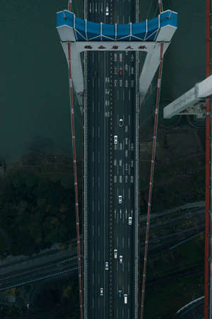 Aerial overhead shot of flyover highway traffic before dawn in Chongqing,Southwest Chinaの写真素材