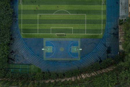 Aerial overhead shot of school football basketball field in Chongqing, southwest China municipal...
