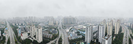 Aerial pano drone shot of populated residence buildings alng Yangtze river in Chongqing, southwest Chinaのeditorial素材