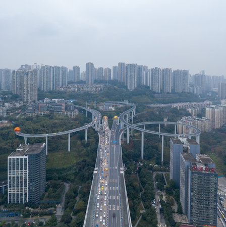 Aerial drone shot of Caiyuanba Flyover with traffic in bleak morning time