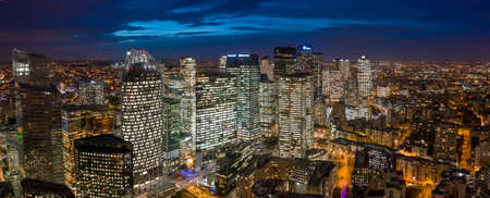 Aerial pano drone shot of La Defense CBD buildings complex after sunset with lights onのeditorial素材