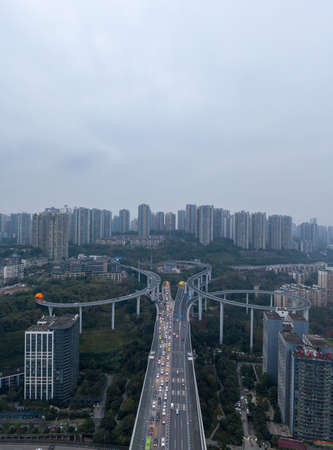 Aerial drone shot of Caiyuanba Flyover with traffic in bleak morning timeのeditorial素材