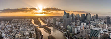 Aerial pano drone shot of La Defense skyscraper complex by la Seine during sunset hourのeditorial素材