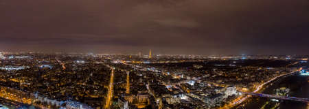 Aerial drone shot of Neuilly-sur-Seine by la seine with Eiffel tower in the farのeditorial素材