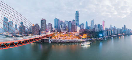 Aerial Pano drone shot of Hong Ya Dong cave by Jialing river with Qiansimen suspension bridgeのeditorial素材