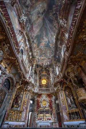 Upward view of ceiling fresco and altar facade inside Baroque church Asamkircheのeditorial素材
