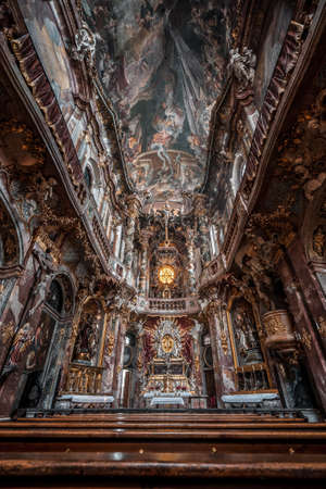 Upward view of ceiling fresco and altar facade inside Baroque church Asamkircheのeditorial素材