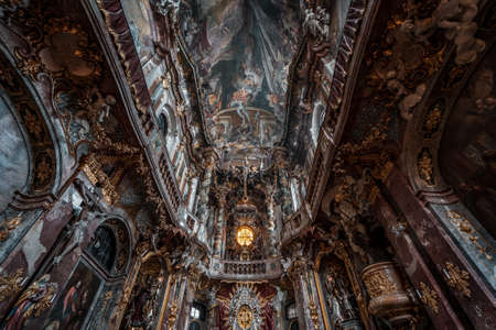 Feb 2, 2020 - Munich, Germany: Ultrawide upward view of ceiling fresco altar facade inside Baroque style church Asamkircheのeditorial素材