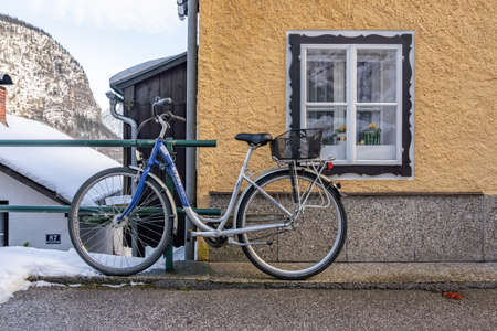 Village street by lake Hallstatt covered in snow during winter in upper Austriaのeditorial素材
