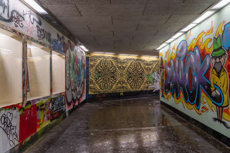 Colourful graffiti on walls of tunnel in Salzburg old city townのeditorial素材