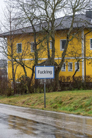 Weird offensive obscene Austrian town name plate in the country fieldのeditorial素材