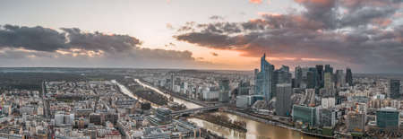 Panoramic aerial drone shot of la defense skyscraper complex with Eiffel tower and La seine during sunsetのeditorial素材