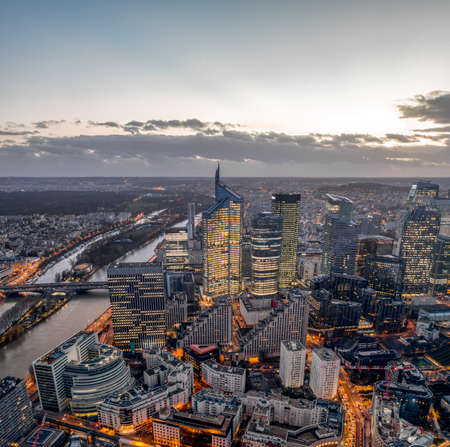 Aerial view of la defense skyscrapers complex after sunset with lights on in Parisのeditorial素材