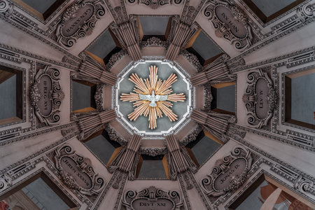 Artwork of pigeon in the center pivot of dome ceiling with mural inside Salzburg Cathedral