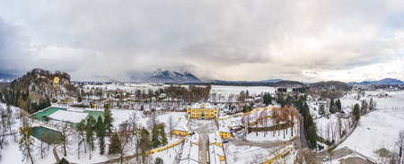 Panoramic aerial view of Schloss Hellbrunn covered in snow with view of Untersberg near Salzburg Outskirts in winterの写真素材