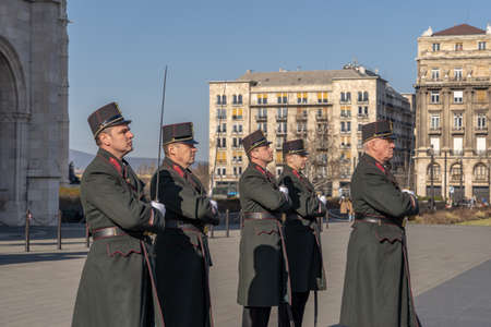 Change of guards in uniform with swords in front of Hungarian Parliament in Budapestのeditorial素材