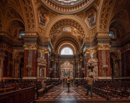 Tourist admire gilded cupola dome of St. Stephen Basilicaのeditorial素材