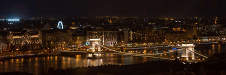 Panorama view of Szechenyi Chain bridge in the night in Budapest, Hungary in the winterの写真素材