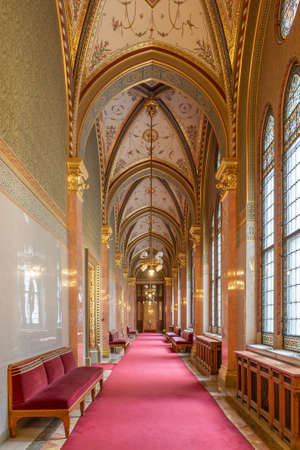 Budapest, Hungary - Feb 10, 2020: Rib vaults corridor with red carpet and gold ceiling in Parliament Buildingのeditorial素材