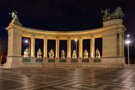 Budapest, Hungary - Feb 10, 2020: Millennium monument sculpture ensemble at Heroes Square in the night with lights onのeditorial素材
