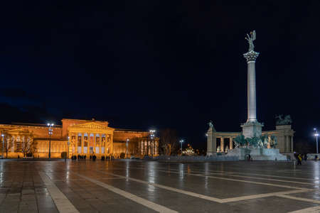 Budapest, Hungary - Feb 10, 2020: Heroes Square in the night with fine art museum and Archangel column in the nightのeditorial素材