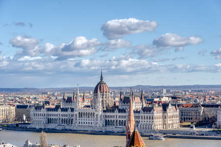 Danube river side view of Hungarian Parliament after sunset at dusk in winter timeの写真素材
