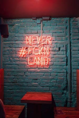 Budapest, Hungary - Feb 10, 2020: Neon light decoration on the wall of Neverland bar in Pestのeditorial素材