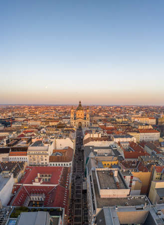 Aerial drone shot of St. Stephen Basilica during Budapest sunset hour in winter timeの写真素材