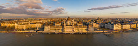 Panoramic aerial drone shot of Hungarian Parliament facade during Budapest sunset hour in winterの写真素材