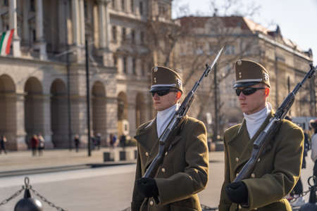Budapest, Hungary-Feb 8, 2020:Change of guards in uniform with swords in front of Hungarian Parliament in Budapestのeditorial素材