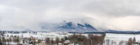 Panoramic aerial view of Snow mountain Untersberg near Salzburg Outskirts in winter timeの写真素材