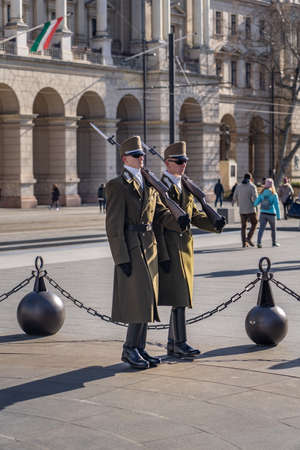 Change of guards in uniform with swords in front of Hungarian Parliament in Budapestのeditorial素材