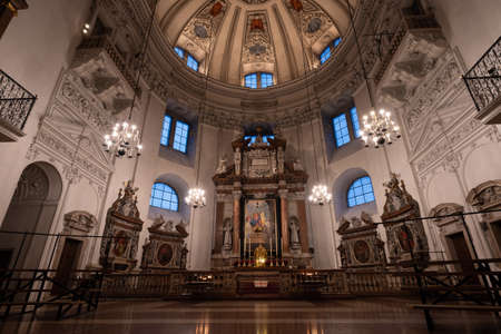 Ultrawide view of dome and ceiling with low light inside Salzburg Cathedralのeditorial素材