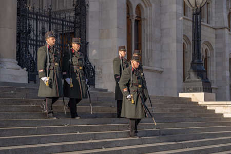 Change of guards in uniform with swords in front of Hungarian Parliament in Budapestのeditorial素材