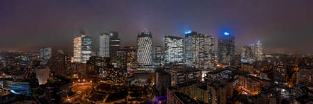Aerial drone night shot of office in Tour Thales DXC Technology in La defense Financal district in heavy fogのeditorial素材