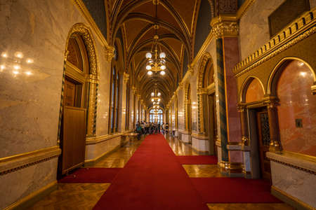 Budapest, Hungary - Feb 10, 2020: Rib vaults corridor with red carpet and gold ceiling in Parliament Buildingのeditorial素材