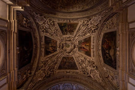 Ceiling mural with paintings inside Salzburg Cathedral with dim lightのeditorial素材