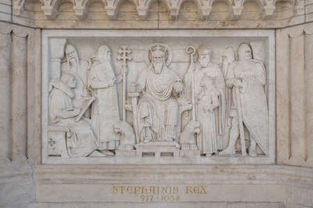 Relif on limesonte under bronze King Stephan statue on Holy Trinity Square in Budapestのeditorial素材