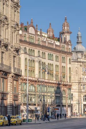 Budapest, Hungary - Feb 9, 2020: Szabad sajto street view with Parisi Udvar Hotel before sunsetのeditorial素材