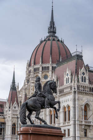 Budapest, Hungary - Feb 8, 2020: Parliament dome view with equestrian statue in Kossuth Squareのeditorial素材