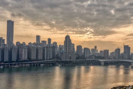 Chongqing, China - Dec 22, 2019: Sunset over Jialing river with dense residence buidingのeditorial素材