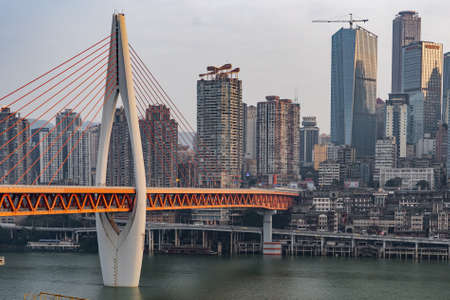 Chongqing, China - Dec 22, 2019: Qian si men suspension bridge over Jialing river by Hong Ya dong cave,のeditorial素材