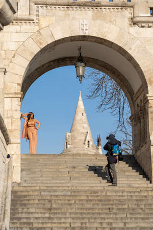 Budapest, Hungary - Feb 9, 2020: influencer pose for photo on Fisherman Bastian stairsのeditorial素材