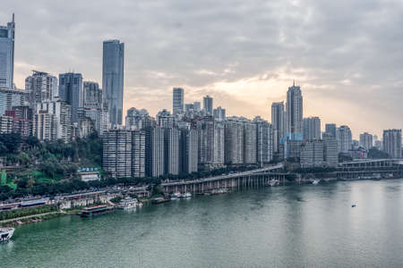 Chongqing, China - Dec 22, 2019: Sunset over Jialing river with dense residence buidingのeditorial素材