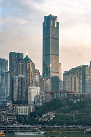 Chongqing, China - Dec 22, 2019: CBD Skyscrapers near Hongya dong cave by Jialing riverのeditorial素材
