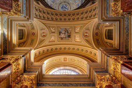 Budapest, Hungary - Feb 8, 2020: Upward view of gildded golden ceiling fresco inside St. Stephen Basilicaのeditorial素材